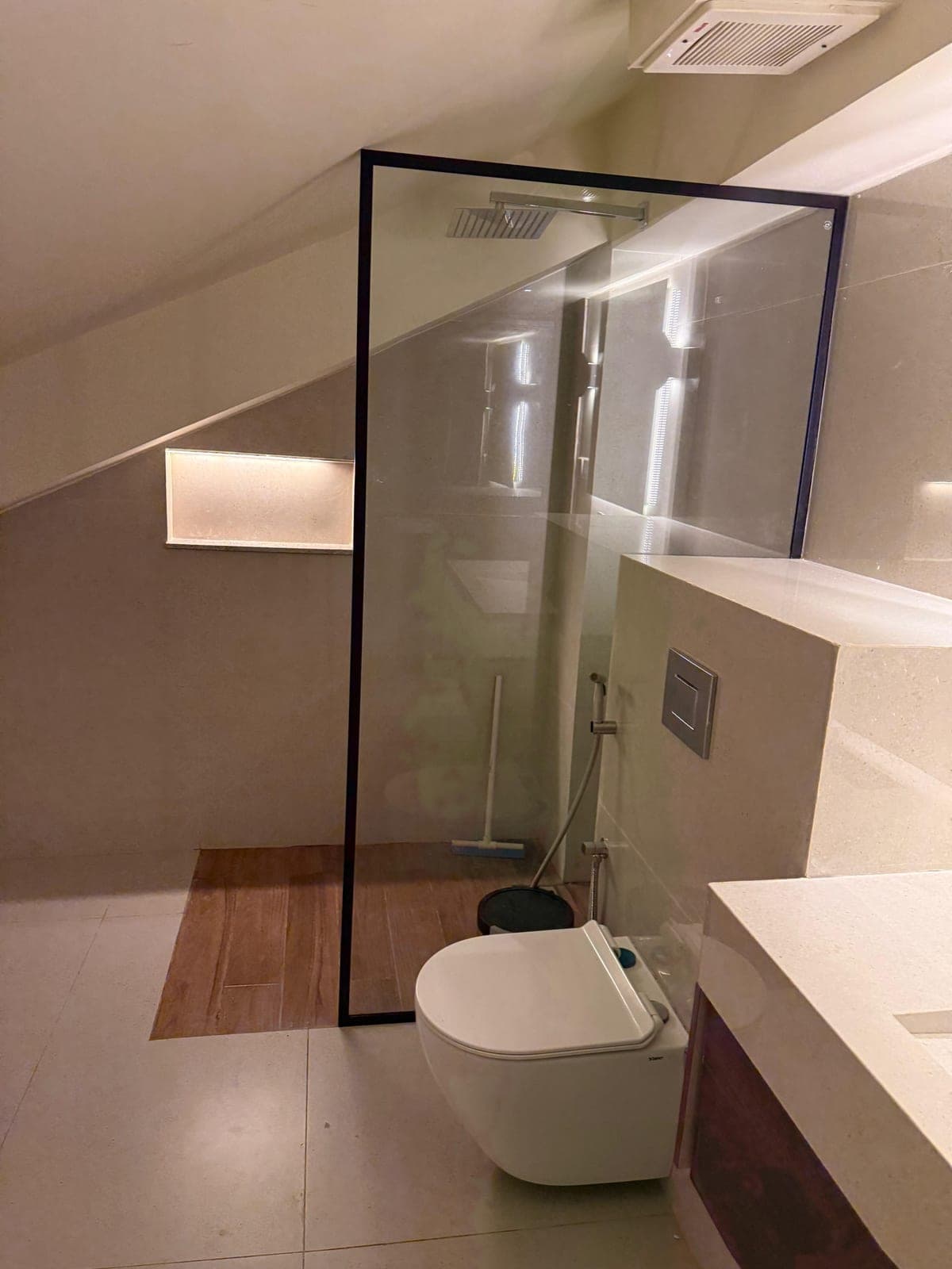 Walk-in rain shower in the attic apartment bathroom at MYG Nathiagali