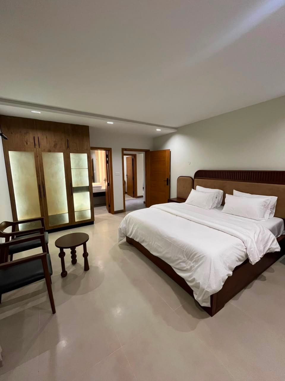 Third furnished bedroom with wardrobes in the three-bedroom serviced apartment in Nathiagali
