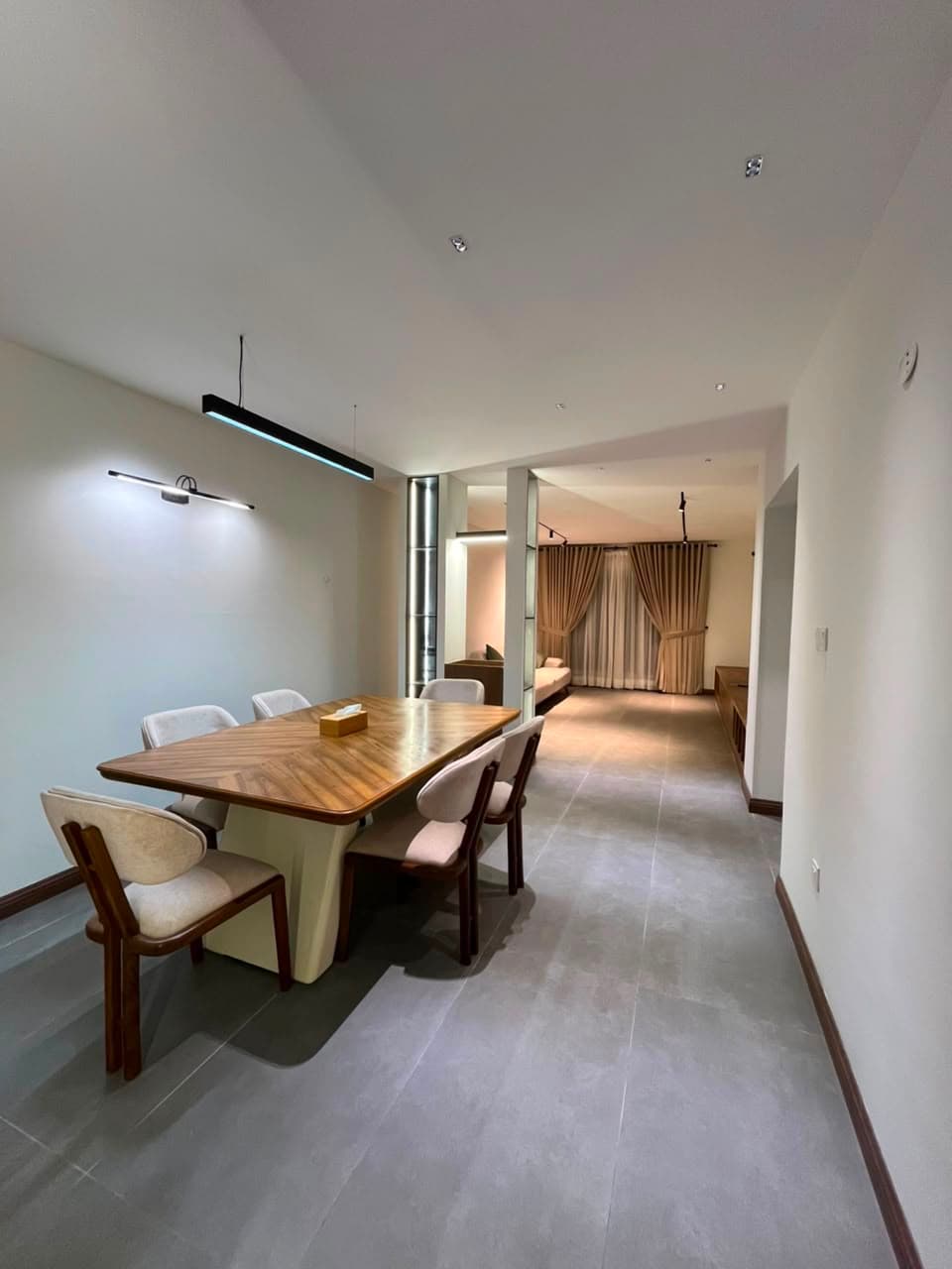 Open dining and living space in a furnished apartment for rent in Nathiagali