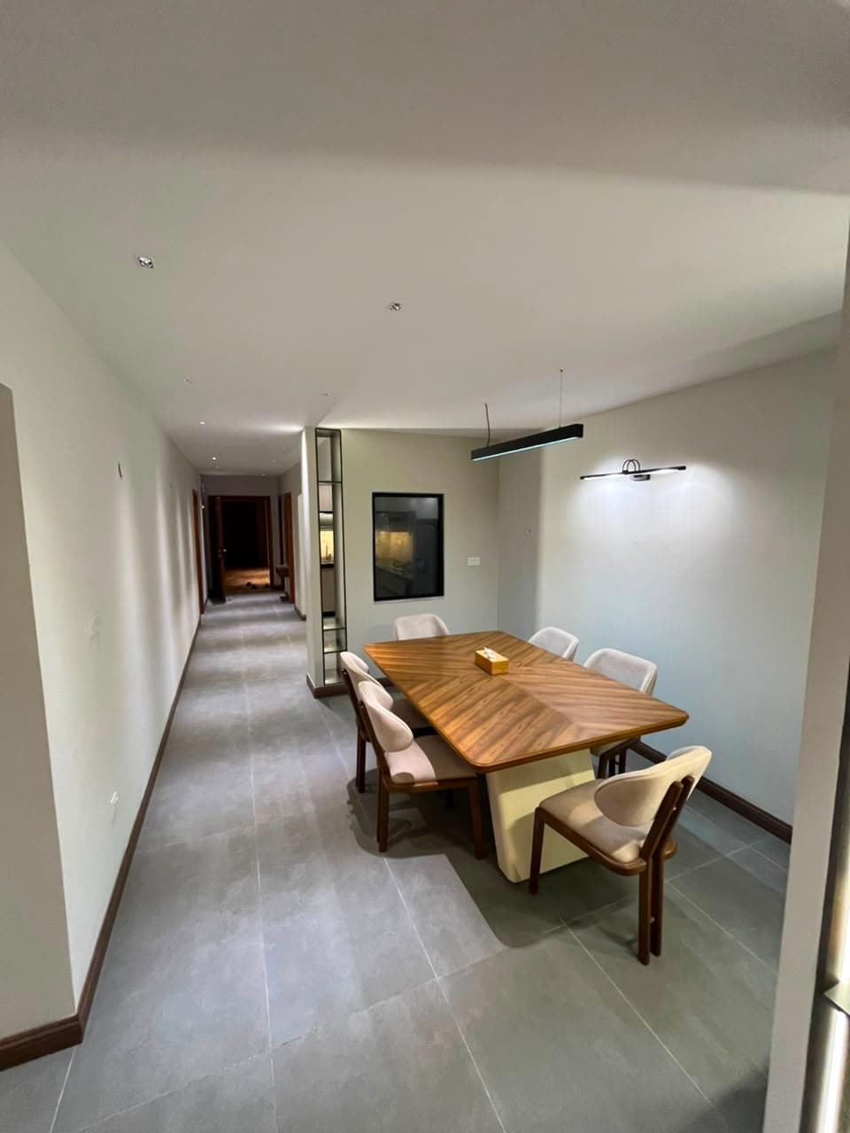 Dining room and hallway of the three-bedroom serviced apartment at MYG Nathiagali